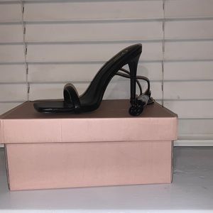 All black leather women tie up 3 inch heels.